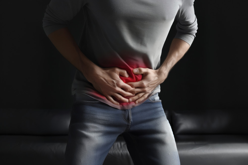 Dr Adarsh Hirjee assessing a patient for hernia repair